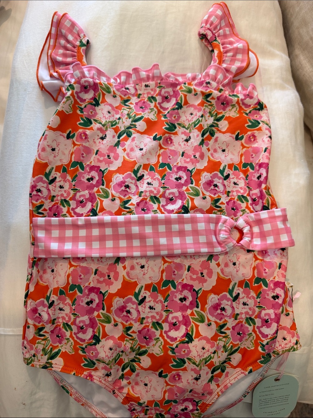 SweetHoney Pink Floral Swim Suit with Orange Background